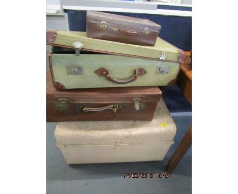 Three vintage leather and canvas suitcases and a painted tin trunk 