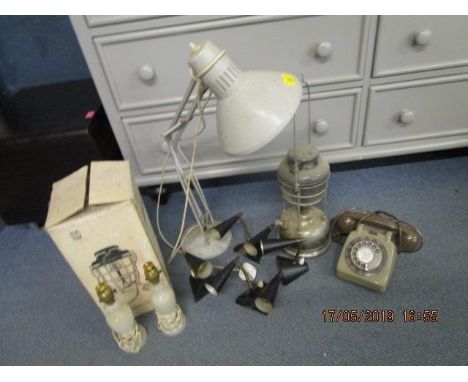 A mixed lot of lighting to include an anglepoise lamp, a boxed storm light and others, along with a vintage finger dial telep