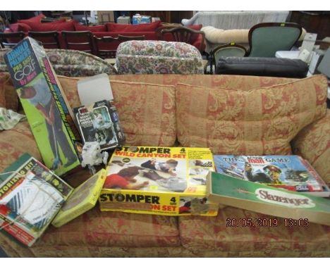 A selection of vintage games and toys to include a Return of the Jedi Scout Walker vehicle, The Action Man game, Motorizing k