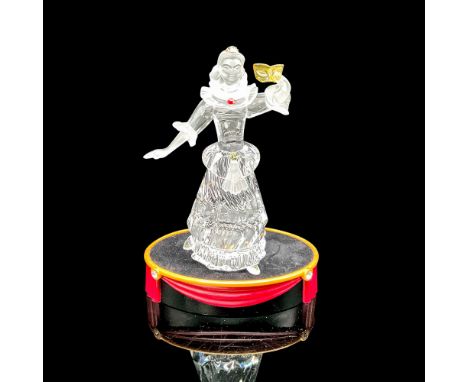 Part of the Masquerade trilogy. Brilliant clear crystal Harlequin with bright blue eyes and arm raised holding yellow crystal
