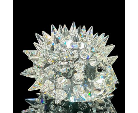 The clear crystal hedgehog has pointed spines, black eyes, and nose, but it lacks whiskers, and its body shape is more oval c