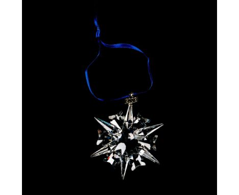 A beautiful clear snowflake with 2002 impressed on a metal tag, ornament #9445NR0200201. Swarovski etched backstamp. This ite