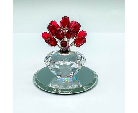 Limited edition. A clear crystal vase with 15 red crystal roses, each have rhodium stems. Swarovski SCS marked. This item has