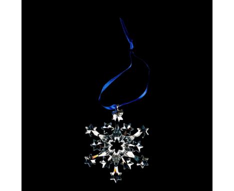 A beautiful clear snowflake with 2004 impressed on a metal tag, ornament #9445NR200401. Swarovski etched backstamp. This item