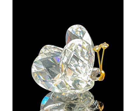 This style features gold antennae with a small gold nose, black eyes, and clear crystal stones adorning the tips of the anten