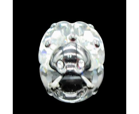 Clear body with black facets on back, black face with clear crystal eyes, metal antennae. Swarovski backstamp. 7604 000 001. 