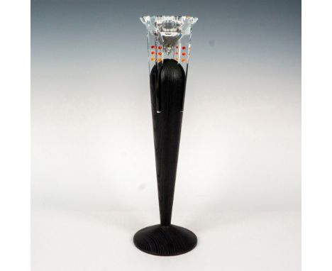 The candle holder is a sleek, narrow design in black, with a removable faceted crystal ball adorned with small fire-colored c