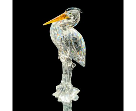 This retired Swarovski piece was part of the â€œFeathered Friendsâ€ theme group. Faceted crystal bird with crystal amber-colo