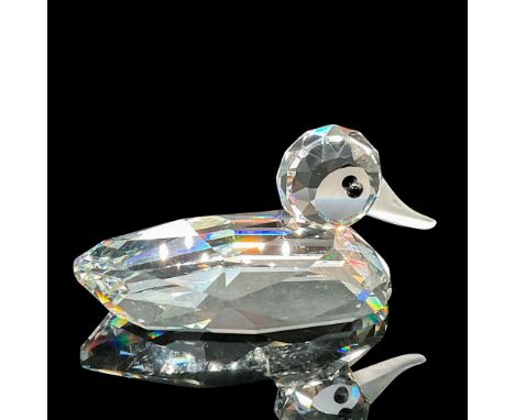 The figurine is made from clear crystal, featuring black eyes, and a frosted bill. Swarovski etched backstamp. This item has 