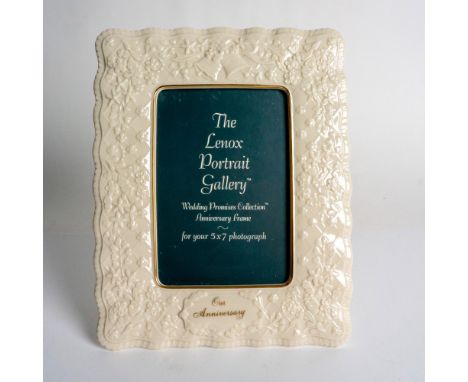 A beautiful 5x7 cream-color floral frame with "Our Anniversary" in gold. Lenox backstamp on the back. This item has its origi