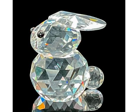 This rare bunny in faceted clear crystal features jet black eyes. This variation has ears that lie flat on the top of his hea