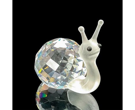 This snail has a fully faceted clear crystal body with an unfaceted frosted head, neck and antennae. Swarovski etched backsta