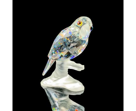 This retired Swarovski crystal parrot is from the â€œUp in the Treesâ€ theme. The parrot is made from clear crystal, has a fr