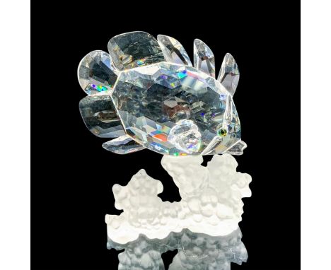 This retired Swarovski piece was part of the â€œSouth Seaâ€ theme. The fish is made from clear faceted crystal swimming past 