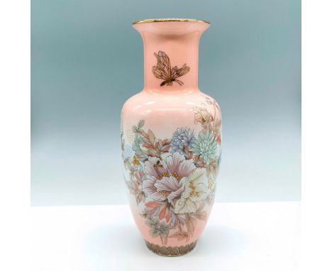 Beautiful light pink Oriental ceramic vase with gilt trim decorated with images of flowers and butterflies. Issued: 20th c.Di