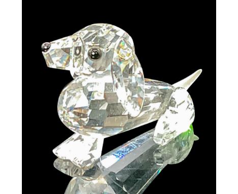 This mini dachshund has a clear faceted body and black eyes and nose, and a frosted crystal tail. Swarovski etched backstamp.