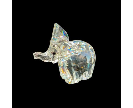 This retired Swarovski crystal elephant was part of the â€œAfrican Wildlifeâ€ theme. A clear faceted elephant with ears out, 