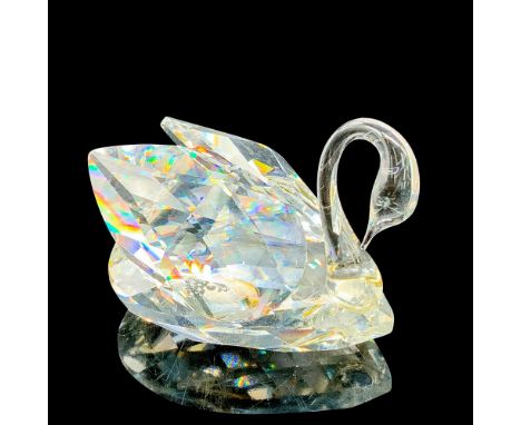 This retired Swarovski crystal small swan was part of the â€œBeauties of the Lakeâ€ theme group. Faceted clear crystal with a