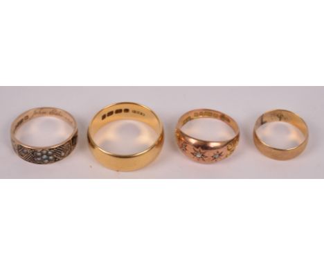 An 18ct yellow gold wedding band, size R/S, a further yellow metal example, a Victorian mourning ring set with seed cultured 