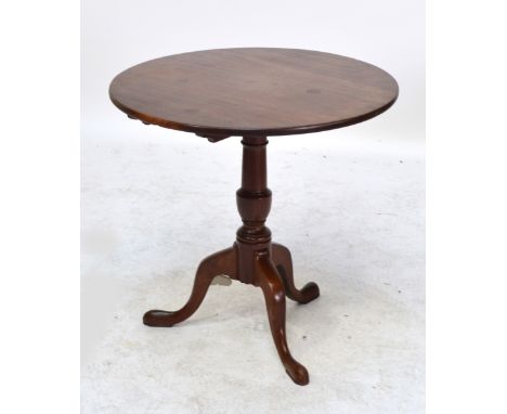 A mahogany circular tilt top occasional table with turned support and tripod outswept legs, diameter 75.5cm, height 73cm.