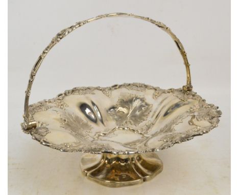 A William IV hallmarked silver circular fruit bowl with cast vines and grapes decorated rim and similarly embossed sides, wit