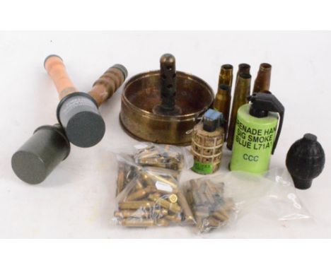 Two reproduction dummy German stick grenades, a smoke grenade, two deactivated grenades, various shell cases, and a large she