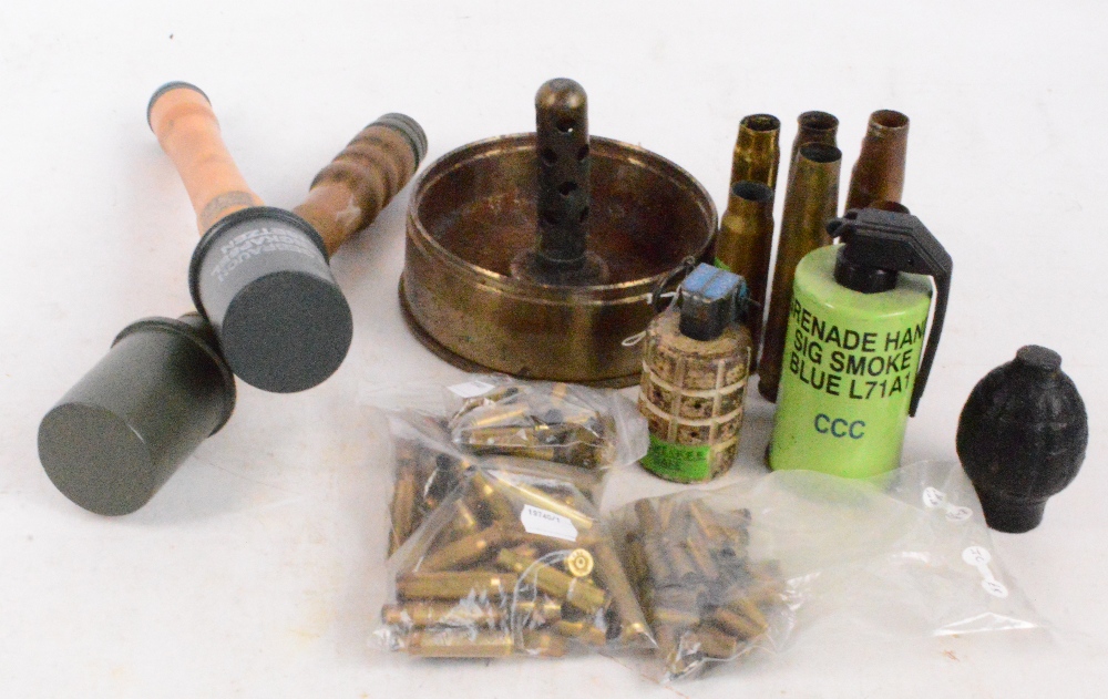 Two reproduction dummy German stick grenades, a smoke grenade, two