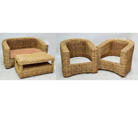 A four piece conservatory suite comprising a two seater sofa, two chairs and a table, all in basket weave, sold without cushi