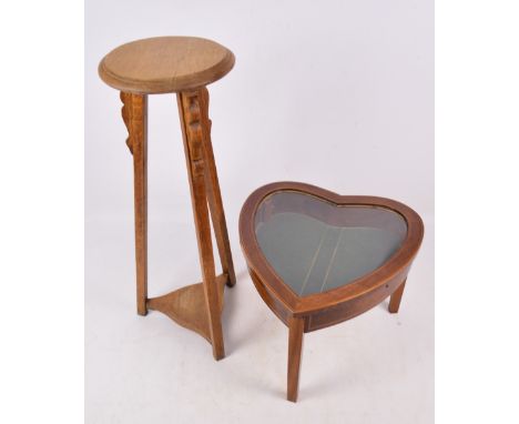 A reproduction heart shaped bijouterie table with string inlay, hinged lid and three tapering squared legs, width 42cm, heigh