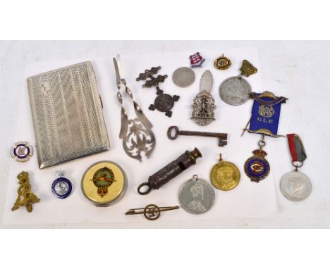 A group of medals and badges to include a hallmarked silver St John's Ambulance Association example with 1931 and 1932 bars a