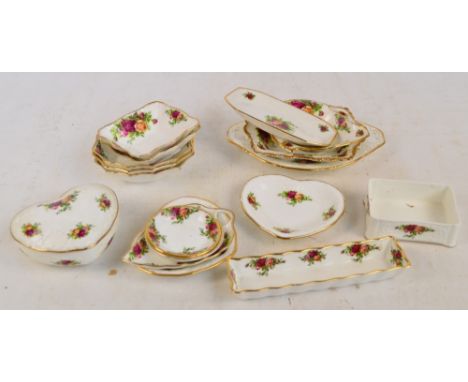 A small collection of Royal Albert "Old Country Roses" pattern decorated pin dishes of various shapes, also a pen tray, a tri