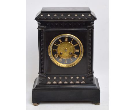 A late 19th century French black slate mantel clock, the circular dial set with gilded Roman numerals and engraved central pa