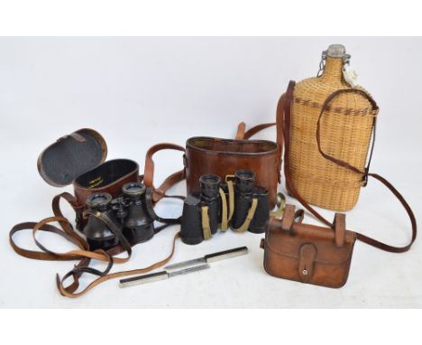 An early 20th century leather cased sandwich tin, a silver plate mounted cased knife and fork by Solingen, two pairs of field