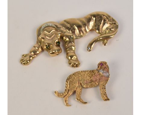 Two 9ct yellow gold brooches; one modelled as a tiger with diamond collar and tail tip, with emerald set eyes, width 6.3cm, t