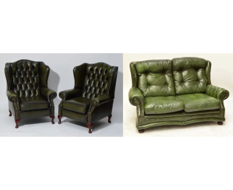 A pair of green leather button upholstered and studded wingback armchairs on four cabriole legs to pad feet, width 80cm, and 