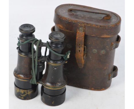 A leather cased pair of WWI military issue field glasses bearing military marks and inscribed "MK V SP 75698", the leather ca