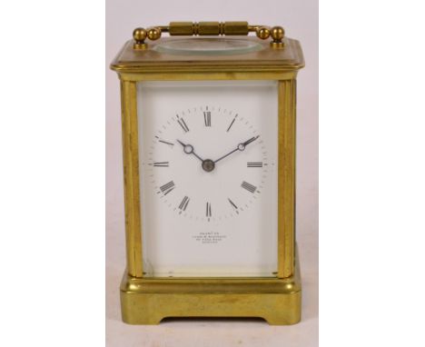 A late 19th century French brass cased fourteen day carriage clock, the white enamel dial set with Roman numerals inscribed "