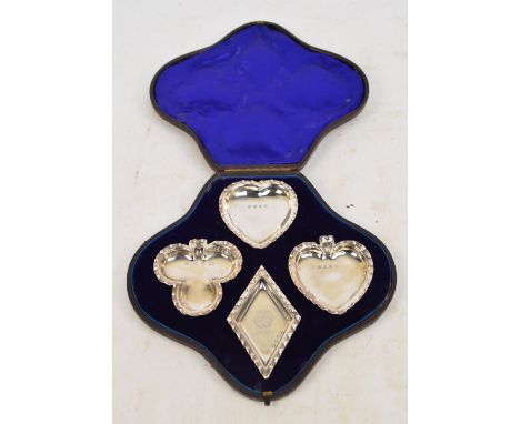 A cased set of four late Victorian hallmarked silver playing card suit dishes, the diamond engraved "1837,1897" with a crown,