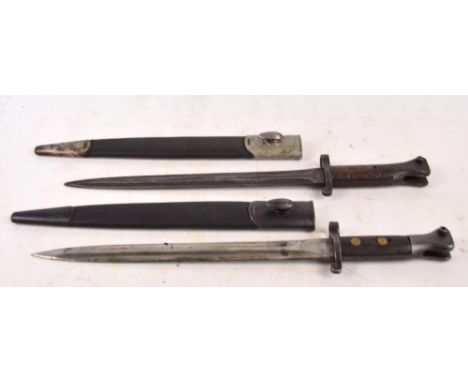 Two WWI period bayonets with leather scabbards, one with Wilkinson blade (2).