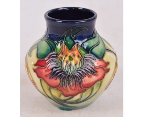 A modern Moorcroft squat vase decorated in the Arum Lily pattern, various painted marks to base, height 8cm, boxed. 