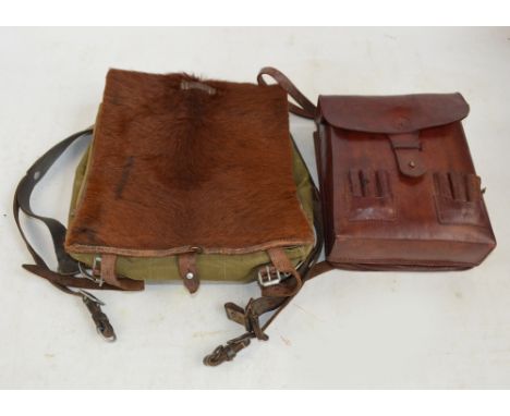 A WWII German canvas and animal skin backpack and a Japanese leather ammunition pouch (2).