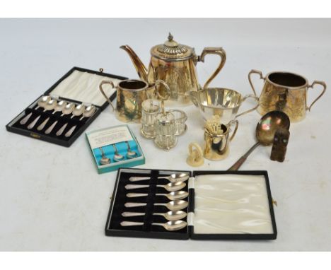 A small quantity of electroplated items including a three piece tea service of oval tapering form with engraved foliate decor