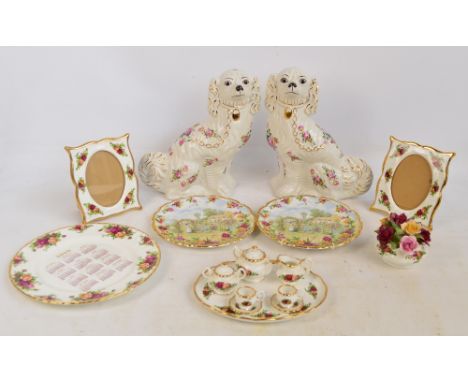 A Royal Albert "Old Country Roses" pattern decorated miniature tea set comprising a teapot, a sugar bowl and cover, a cream j