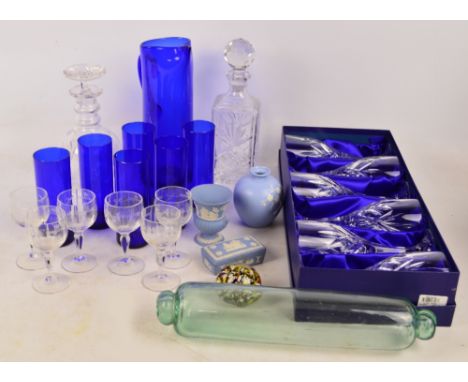 A quantity of mixed glassware including a boxed set of six Royal Doulton crystal large wine glasses, a blue ewer with a set o