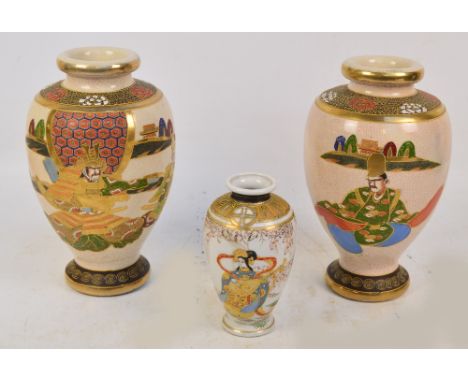 A pair of decorative Japanese Satsuma crackle glaze baluster vases decorated with figures in a formal setting, height 32cm an