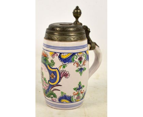 A late 18th/early 19th century German faience tankard with pewter cover set with copper Danish one skilling 1771 coin, centre