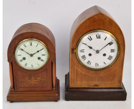 A 1930s mahogany lancet shaped mantel clock with associated plinth, the circular white enamel dial set with Roman numerals, h