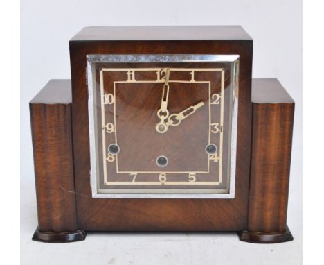 A 1940s walnut mantel clock, the square dial set with Arabic numerals, length 29.5cm.