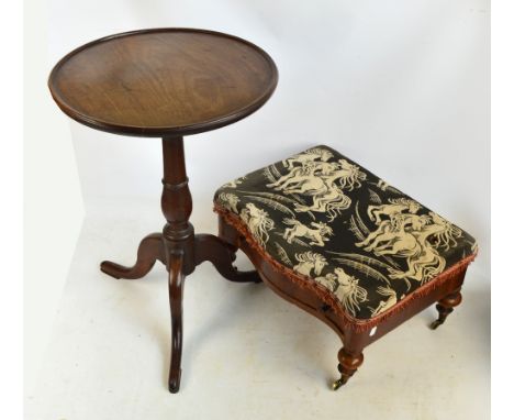 A George III mahogany dish topped tripod occasional table raised on three outswept supports, the one piece top diameter 49.5c