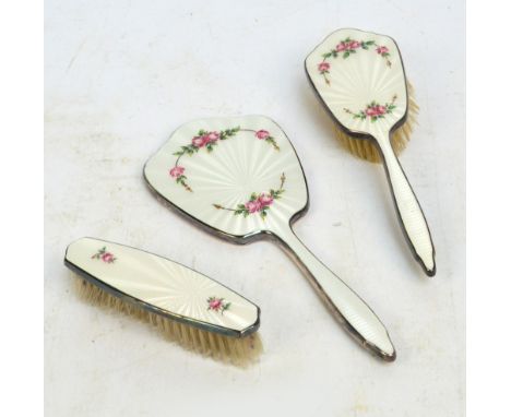 A white metal mounted and guilloche enamel decorated three piece dressing table set with transfer floral sprays, Adie Bros, a
